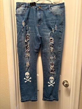 Blue Distressed Women's Jeans with Skull Appliqué